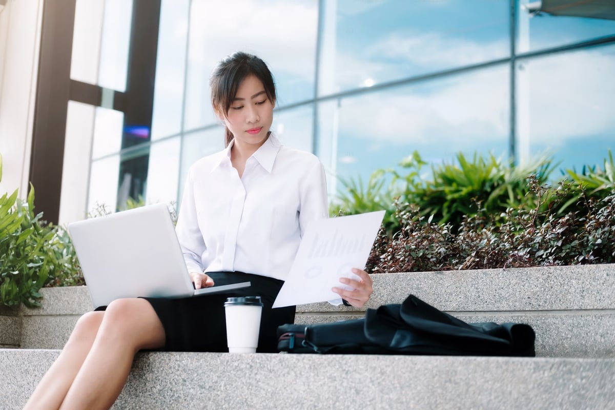 Business woman working and drinking coffee